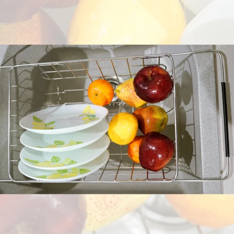 Stainless steel sink basket with sturdy handles for easy lifting and portability.
