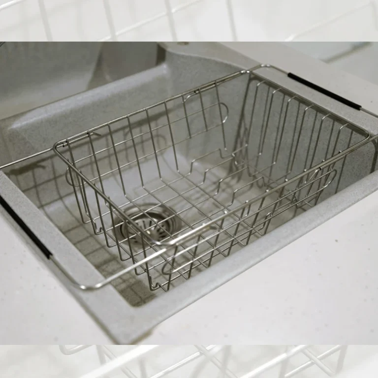 Adjustable over-the-sink dish drying basket for easy utensil storage.
